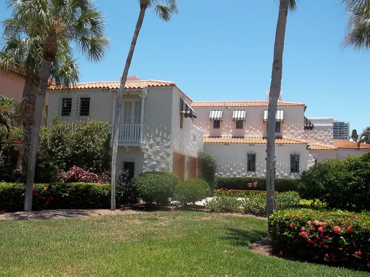 Lawn repair finish, a level front lawn with palms at a Florida home